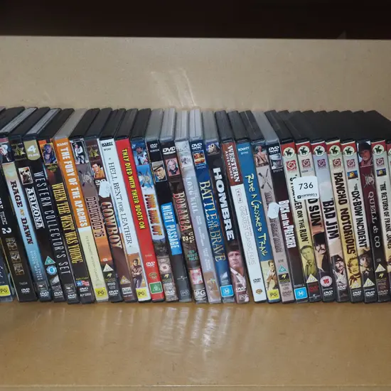 shelf of cowboy DVDs
