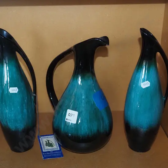 3x Blue Mountain ewer vases - smaller has chip to rim Tallest H280