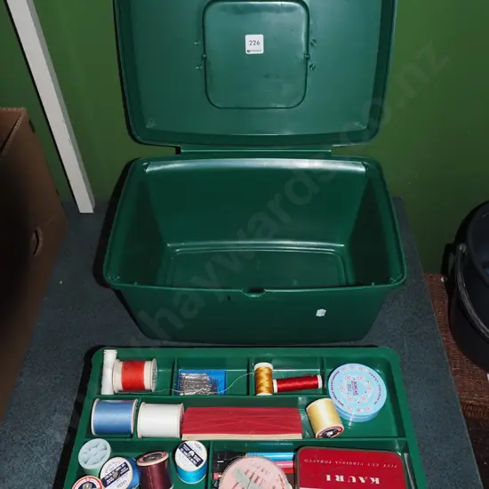 green plastic sewing box and contents