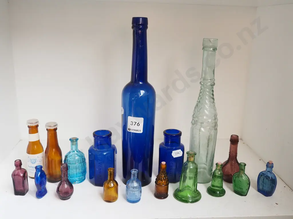 shelf; various coloured bottles, other bottles Tallest H270 Image 1++