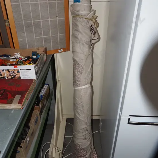 bolt of loose weave patterned fabric