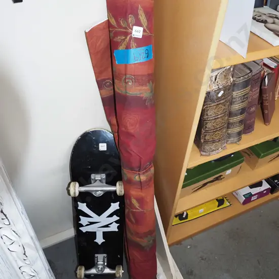 bolt of burgundy upholstery fabric