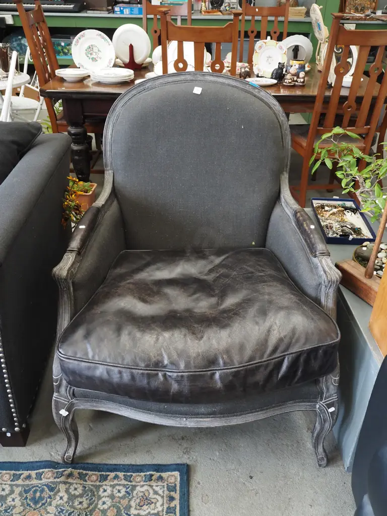 leather and charcoal upholstered carved wooden armchair Image 1++