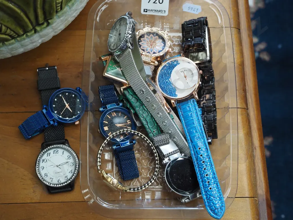 tray of wristwatches Image 1++