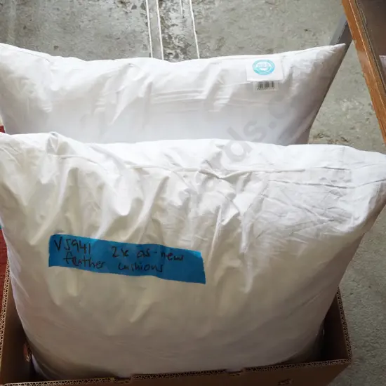 box; 2x as new feather cushions