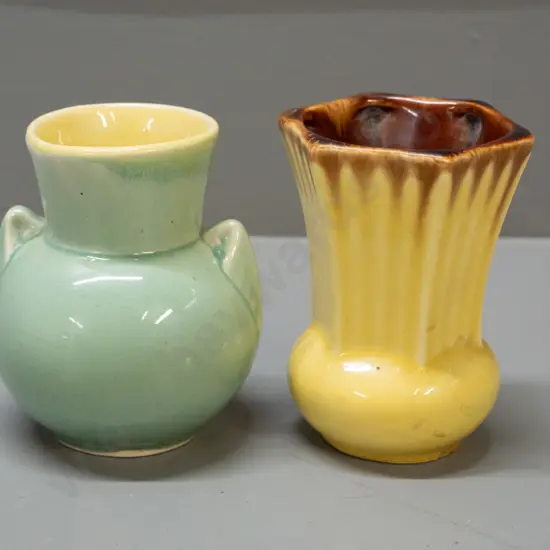 2 vintage Crown Lynn small vases - celadon green with handles, yellow interior, marked .134. and a faceted
