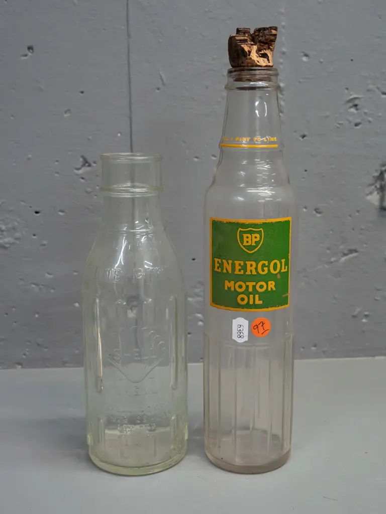 2 clear glass one pint oil bottles - BP with labelling H-290 and clear Shell New Zealand Image 1++
