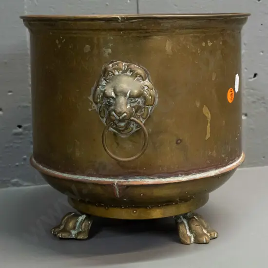 brass jardiniere with lion's head ring handles and 3 paw feet - some discolouration, marks H-220 W-300