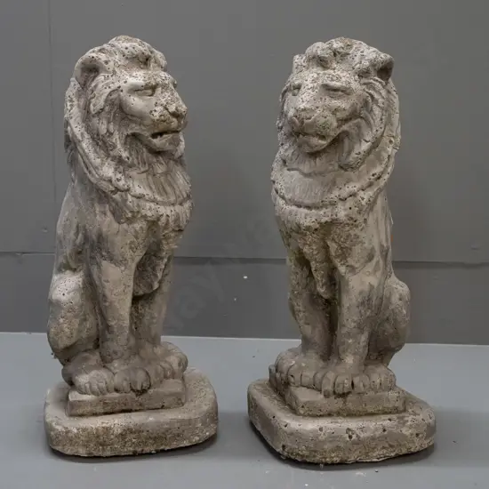 pair of small cast concrete seated lion garden figures - some weathering and wear H-370