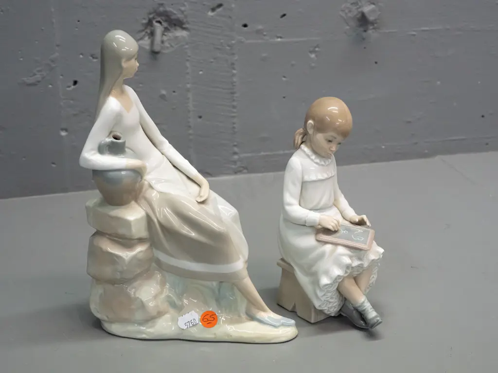 2 Nao figurines - seated woman with urn H-250 W-170 and seated girl with slate Image 1++