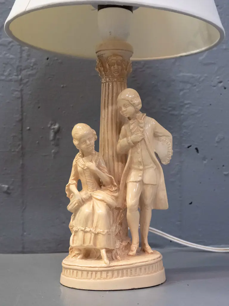 composite lamp base with Italian style fluted column & romance scene with plain conical shade - going, has a few small Image 1++