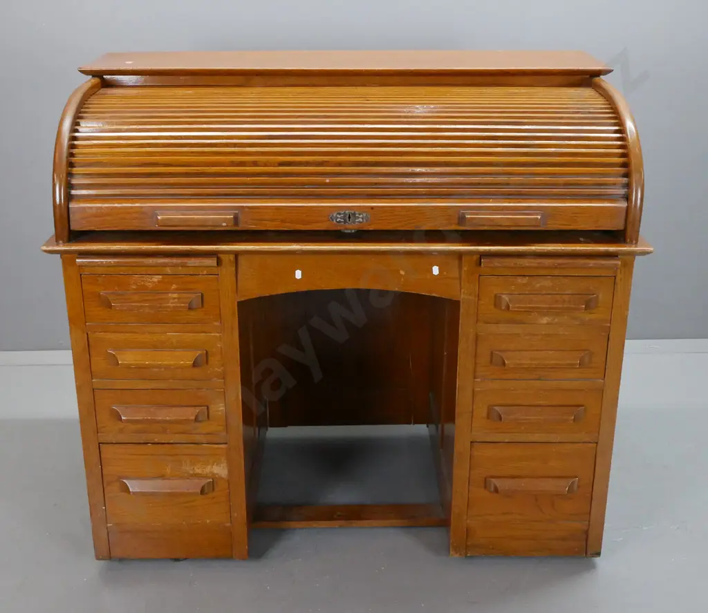 mid-century oak roll-top desk, tambour lid exposing pigeon holes above 2 pedestals w/ 8 drawers & 2 slides. Tambour top Image 1++