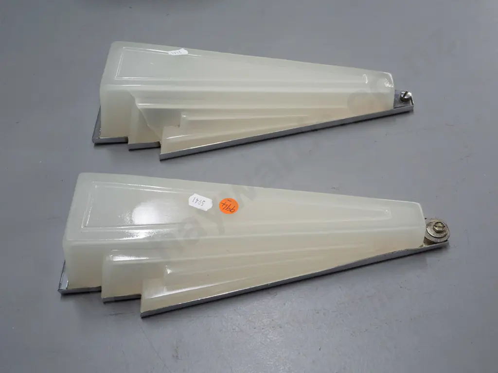 pair of art deco wall mount light fittings with faceted triangular semi-opaque glass shades, chrome backing plates. One Image 1++
