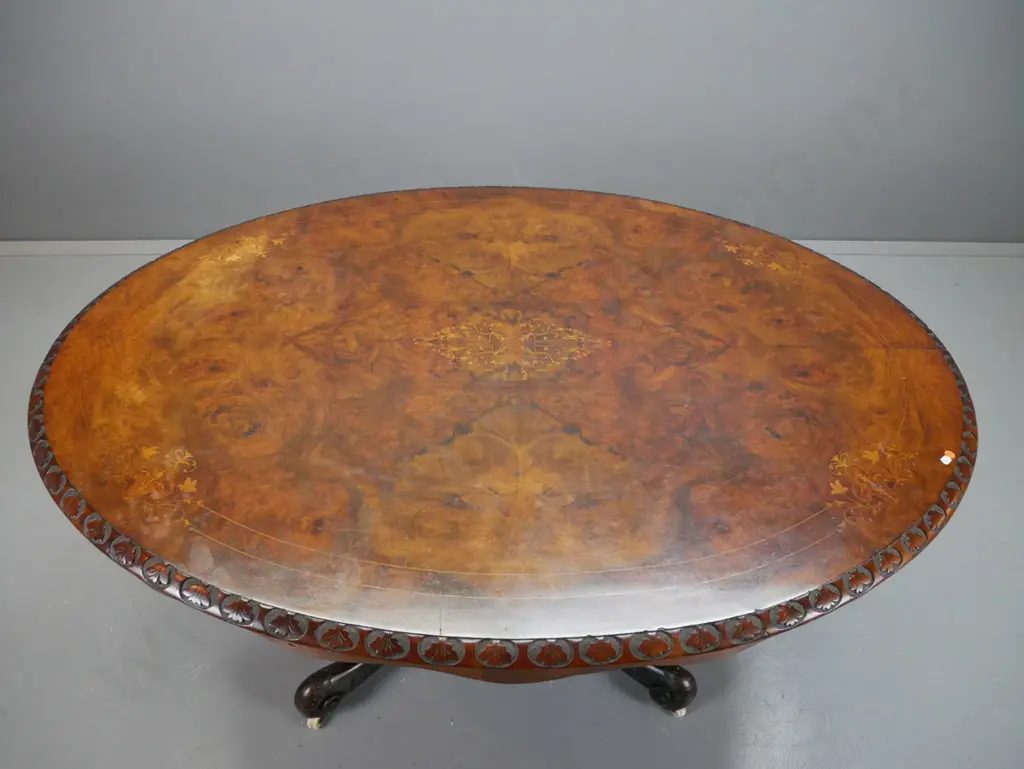 Victorian walnut dining table, with boxwood foliate inlaid top, carved foliate edge, above 4 point Image 1++