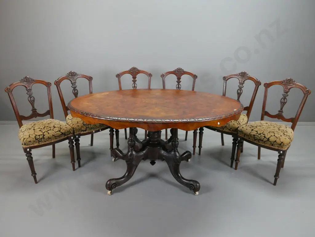 Victorian walnut dining table, with boxwood foliate inlaid top, carved foliate edge, above 4 point Image 1++