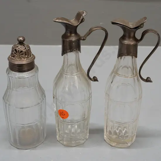 3 piece faceted sided glass condiment bottles. 2 jugs with hinged lids (lion stamp inside lids) & sugar H165