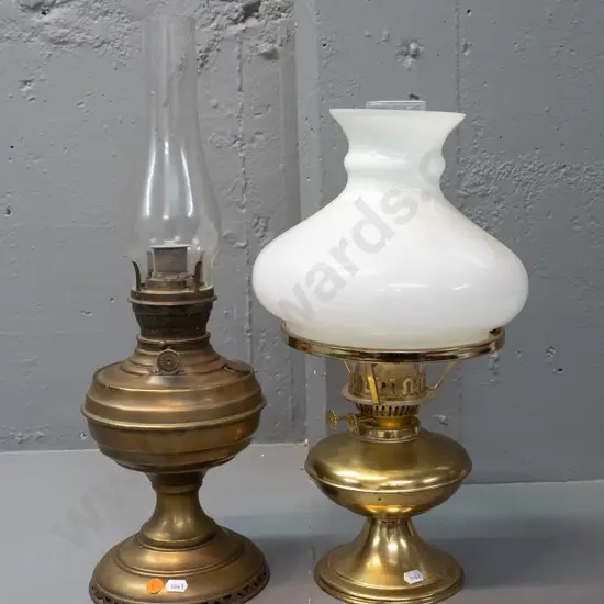 2 kerosene lanterns - both with clear glass chimneys, one with milk glass shade, no maker's mark, other marked "Made In