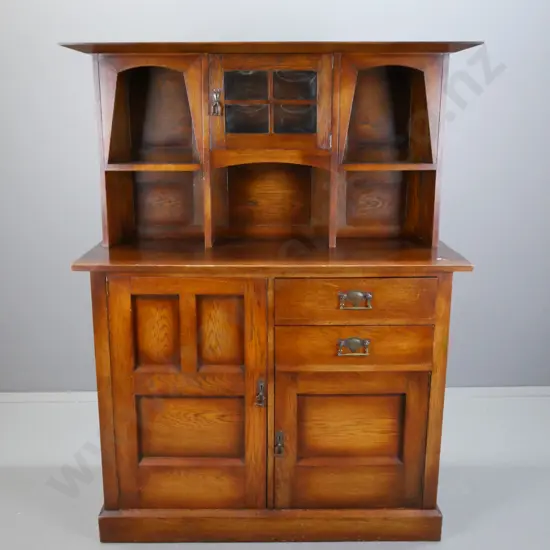 arts & Crafts oak vintage sideboard, small central cupboard door w/ slumped glass panels flanked by 2 arch top shelves