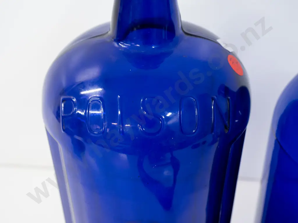 2 large Bristol blue glass bottles, one marked Poison on shoulder H-340, other with faint scratched markings, Image 1++