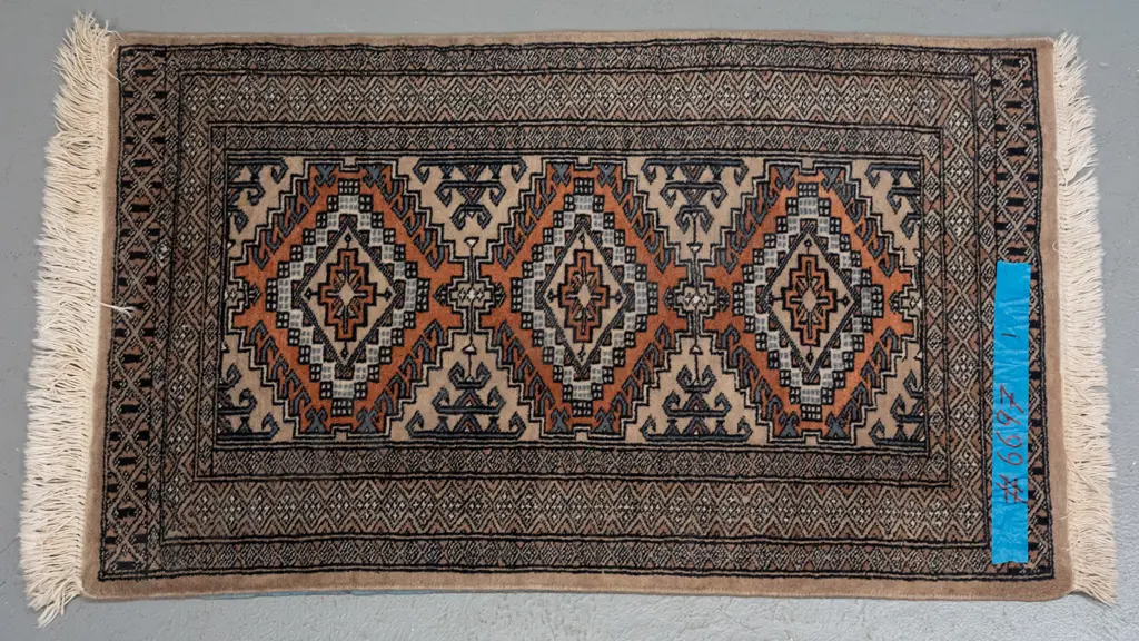 small hand knotted woolen Persian style rug, geometric motifs, black, blue & brown colours H100 W630 Image 1++