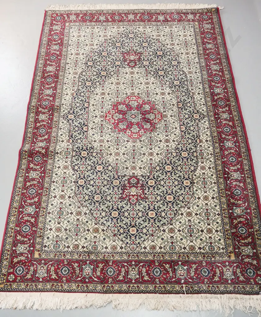 Persian style wool floor rug in dark red, blues, greens and cream - some staining to fringe L-2040 W-1280 Image 1++