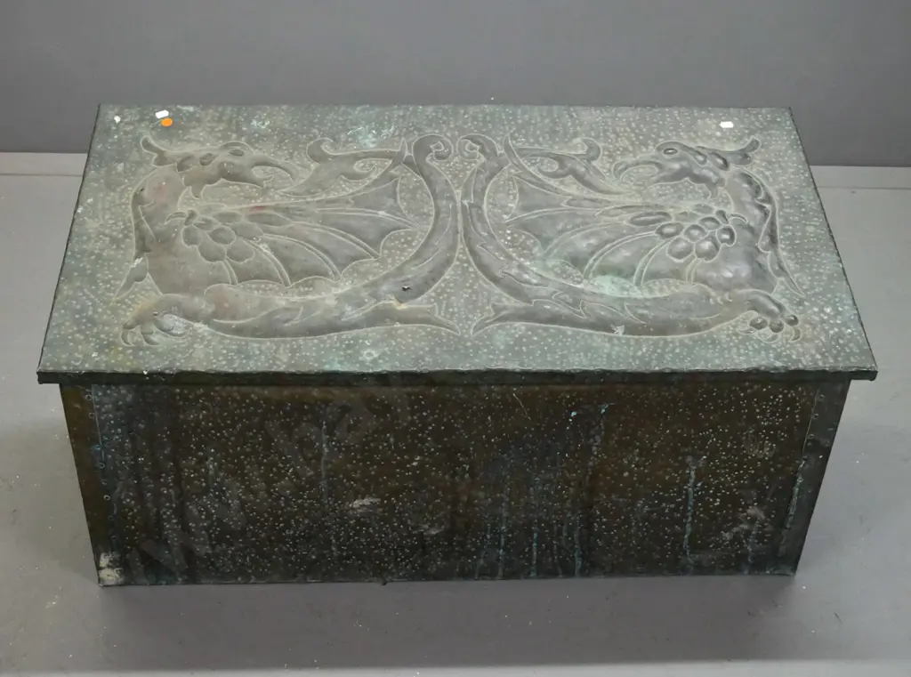 vintage hand-beaten brass woodbox, wood-lined, w/ intertwined dragons to slanted top. Deterioration to wood inside, rust Image 1++