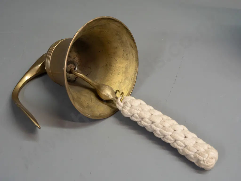 cast brass bell on swiveling wall bracket with plaited cord pull - bell is H-155 D-135 Image 1++