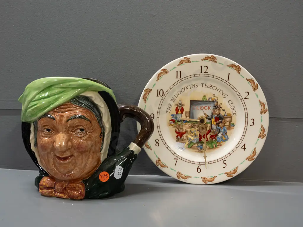 Royal Doulton large Sarey Gamp character jug H-165 and a Bunnykins wall clock - loose hands and movement need attention. Image 1++