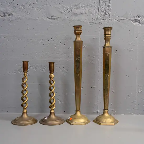 2 pairs of brass candlesticks - engraved larger pair not quite matching, and open-twist pair has some corrosion to base