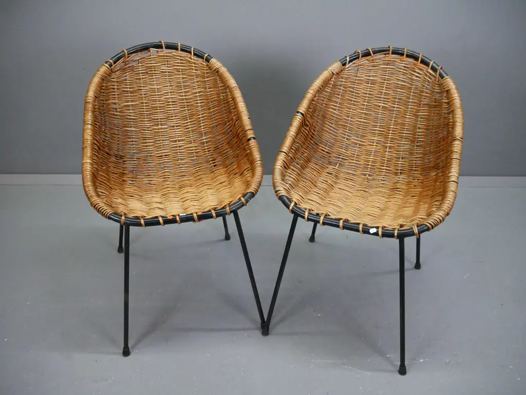 pair of mid-century French woven cane shell chairs with black painted metal frames. Some wear to paint and cracks / Image 1++