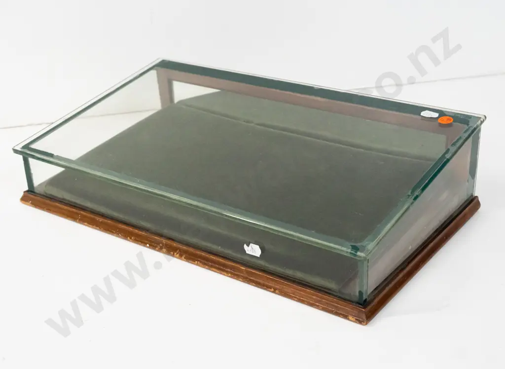 glazed slope fronted counter jewellery display case with hinged mirrored back, felt-lined. Some chipping to edge of Image 1++