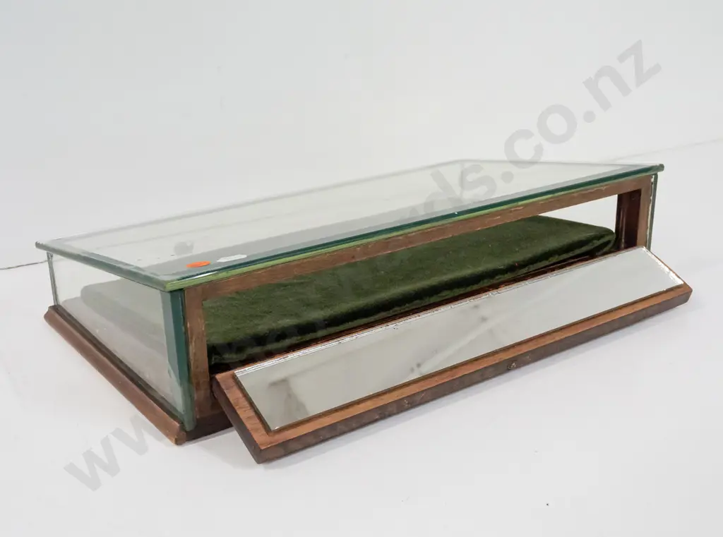 glazed slope fronted counter jewellery display case with hinged mirrored back, felt-lined. Some chipping to edge of Image 1++