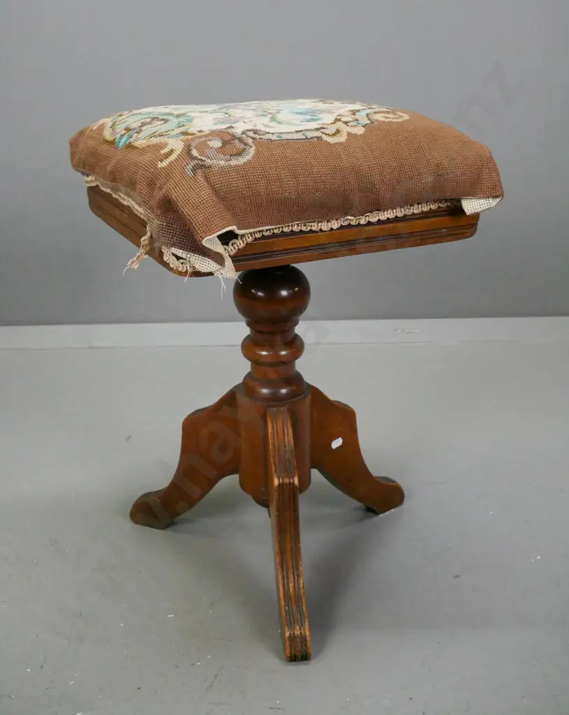 Edwardian revolving piano stool in beech & mahogany, loose-fitting tapestry seat w/ velvet below. On 3 shaped reeded Image 1++
