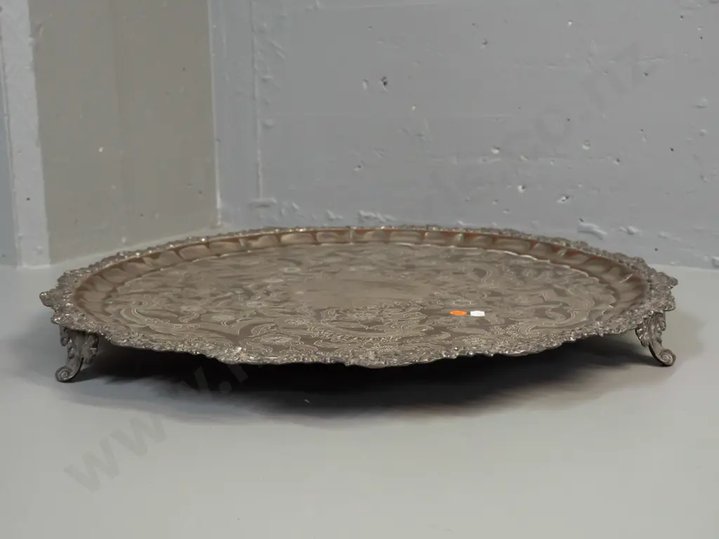 large silver plated circular footed serving tray with 3 scrolling feet and scroll shaped edge - some copper showing Image 1++
