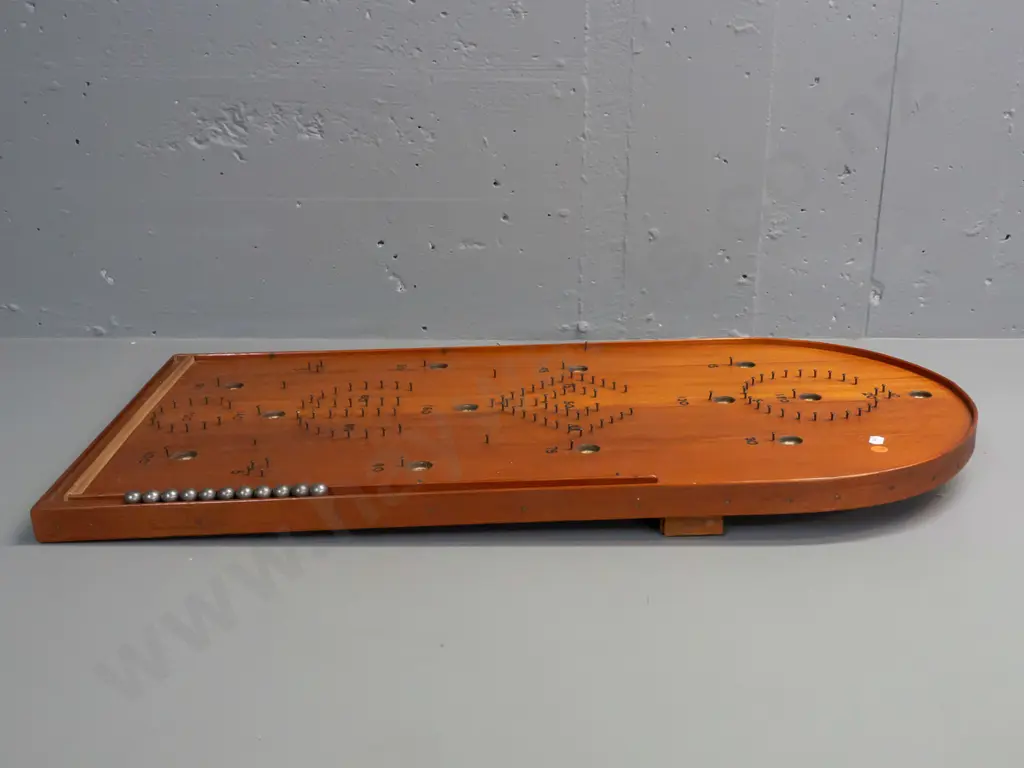 vintage NZ home made rimu bagatelle game board with 11 steel ball bearings in storage cutout inside leg Image 1++