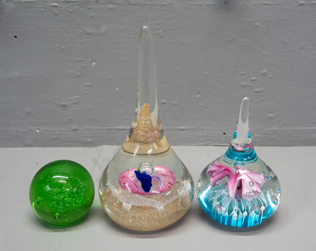 3 glass paperweights - 2 teardrop shaped with floral designs, taller is H-160, and a small Hokitika green bubble globe Image 1++