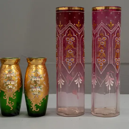 pair of Victorian cranberry & clear cylindrical glass vases with gilt and enamel decoration and a pair of green Bohemian