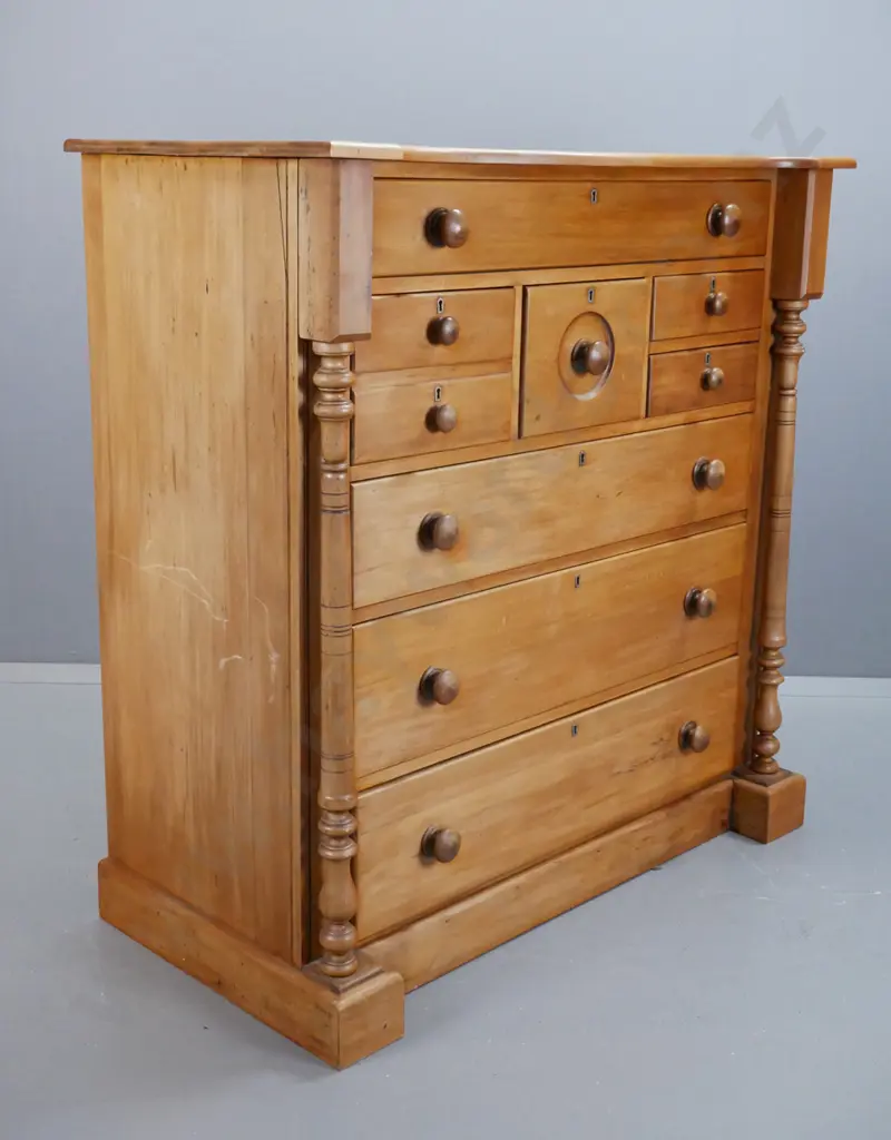 vintage rimu 8-drawer chest with turned columns and wooden knobs, brass escutcheons, on plinth base. Split to one side, Image 1++