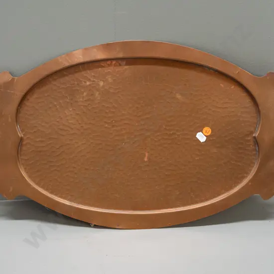 nouveau style hand-beaten copper (or copper plated?) tray with brass handles. Some dents, scratches & discolouration
