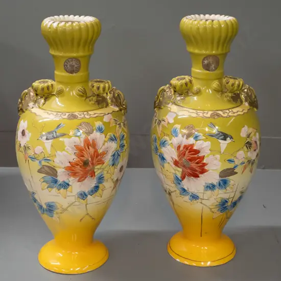 pair of Satsuma style hand decorated floral & bird motif vases with fluted bud-shaped top, applied floral handles. Both