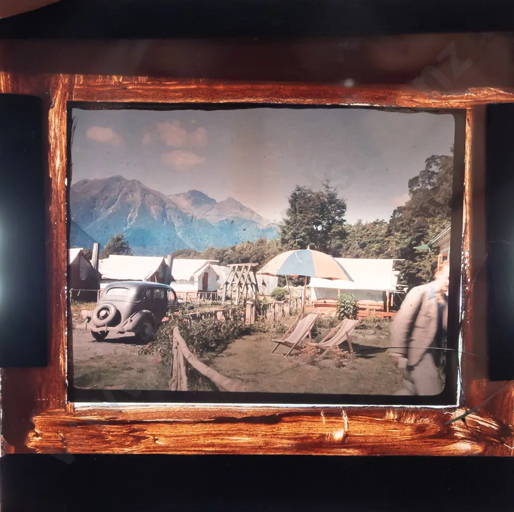 wooden box with assorted glass lantern slides, mostly (hand painted?) amateur houses and scenics, including a 16mm film Image 1++