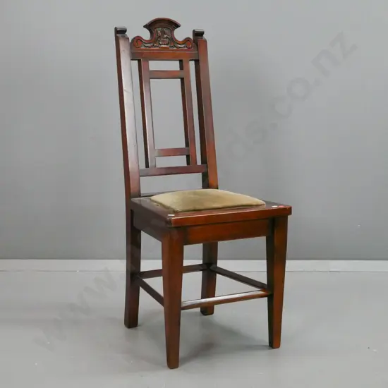 Edwardian dark stained kauri side chair with square section back splat, foliate carved top rail, square tapered legs and