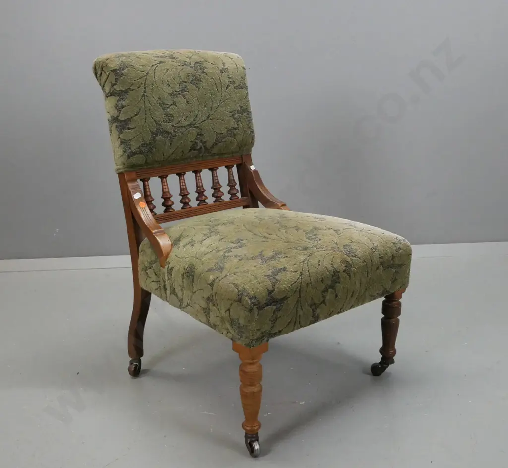 Edwardian walnut upholstered bedroom chair w/ turned gallery in back, turned legs w/ casters, green foliate upholstery, Image 1++