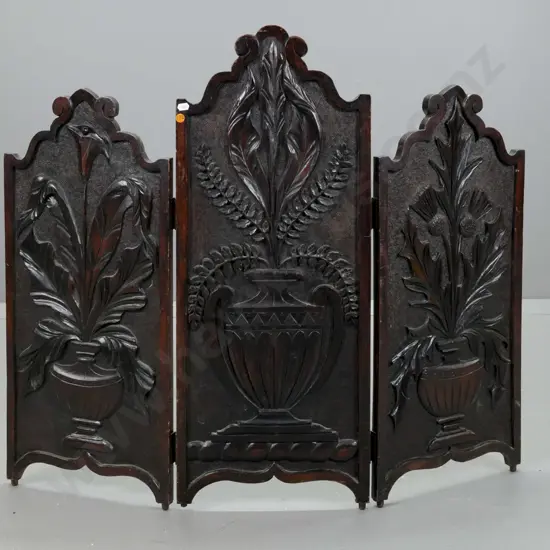vintage dark-stained kauri carved 3-fold fire screen. Carved panels depicting urns holding Scotch thistle, lily, & fern