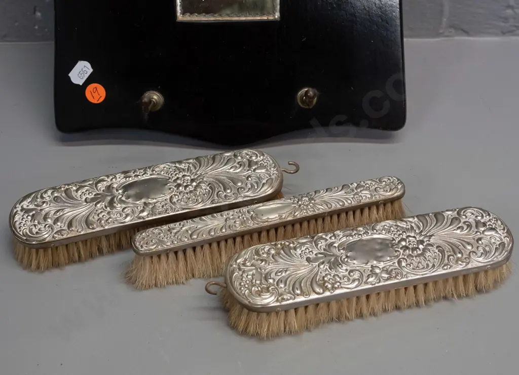 vintage wall hanging brush set with arch shaped mirror, 3 brushes with plated backing, some dents. H-320 W-220 Image 1++