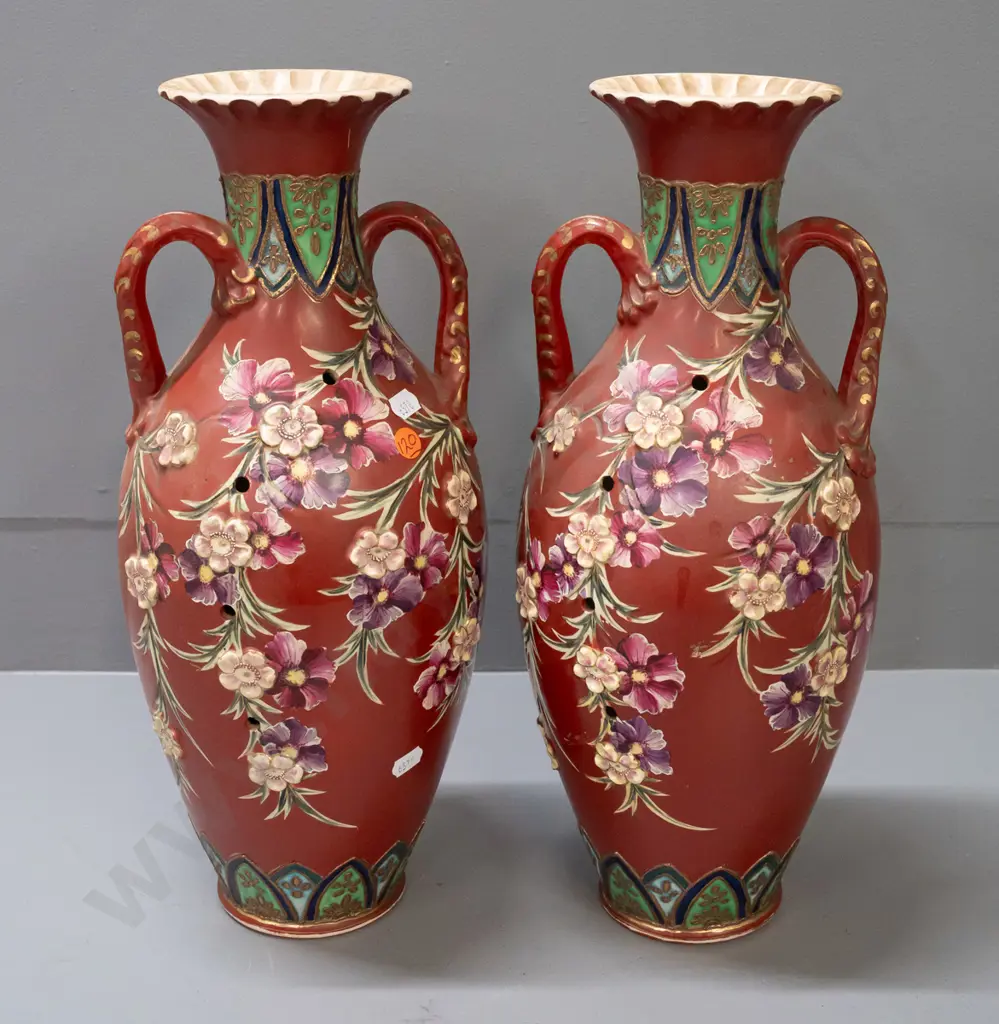 pair of handled vases with applied flowers and Satsuma style decoration, with lines of holes in sides, some staining Image 1++