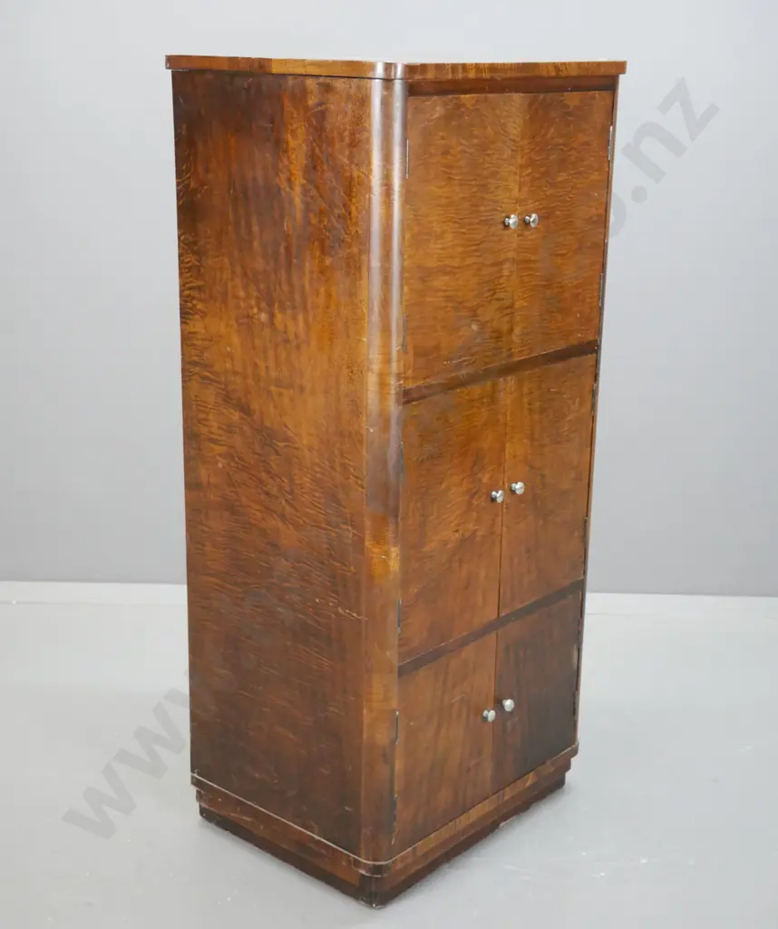 art deco figured laminate 6-door cabinet with rounded corners on plinth base, w/ chrome knobs. Some corrosion to knobs & Image 1++