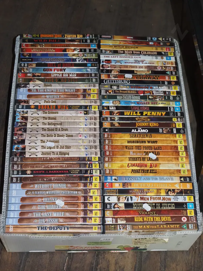 box of cowboy DVDs Image 1++