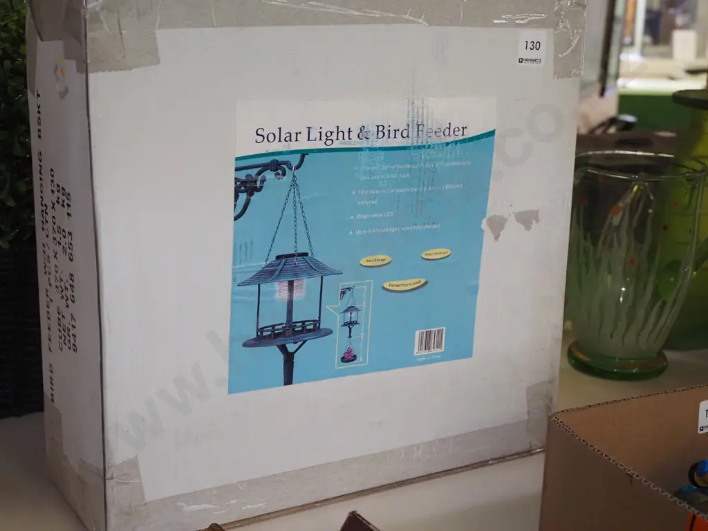 boxed as new solar light and bird feeder Image 1++