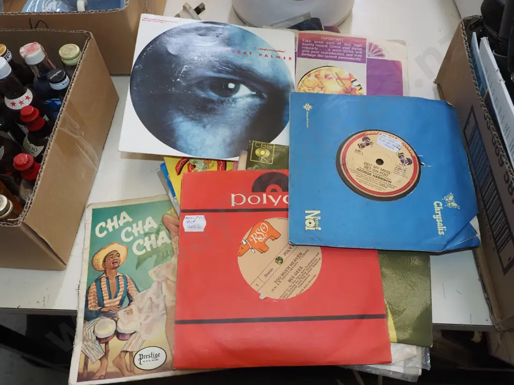 stack of 45s; George Harrison, Robert Plant etc Image 1++